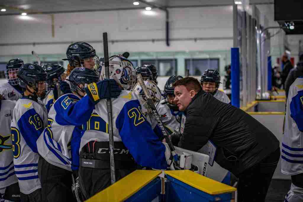 Coaches Talking to the team between peroids - Whales